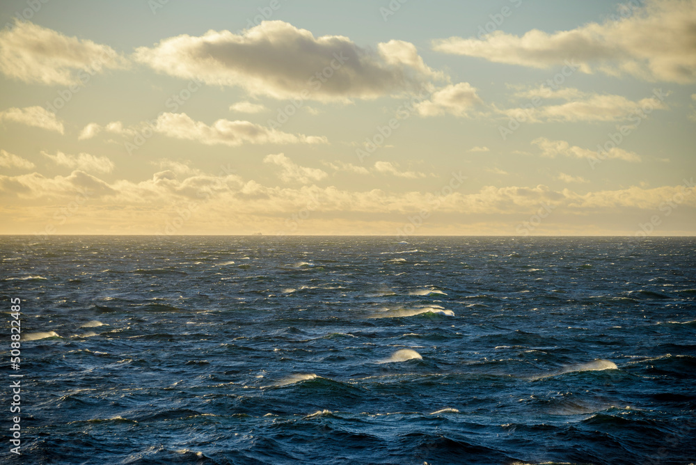 Obraz premium Beautiful seascape - waves and sky with clouds with beautiful lighting. Golden hour.