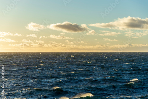 Beautiful seascape - waves and sky with clouds with beautiful lighting. Golden hour.