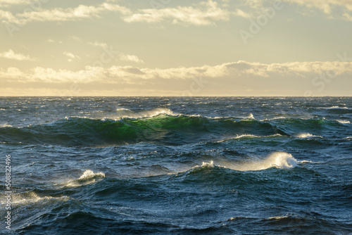 Fototapeta Naklejka Na Ścianę i Meble -  Beautiful seascape  waves and sky with clouds with beautiful lighting.  Golden hour.