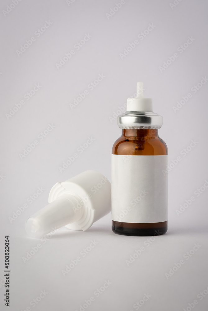 brown glass nasal spray bottle mockup, medical moisturizer for flu and allergies, pharmaceutical aerosol with pump on a neutral gray background, with blank label brown glass nasal spray bottle mockup, medical moisturizer for flu and allergies, pharmaceutical aerosol with pump on a neutral gray background, with blank label