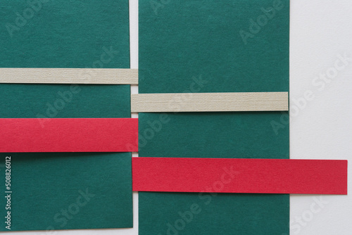 green, red, and beige paper background