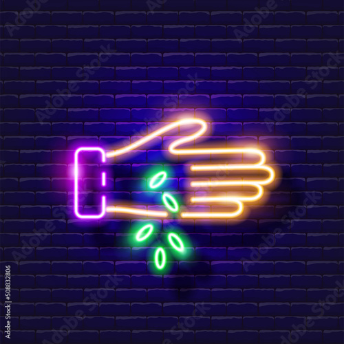 Planting seeds neon icon. Gardening and agriculture concept. Vector sign for design, website, signboard, banner, advertisement.
