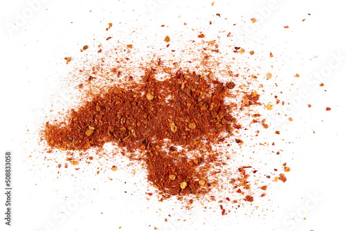 Spicy chili pepper flakes, crushed, milled dry paprika pile isolated on white, top view