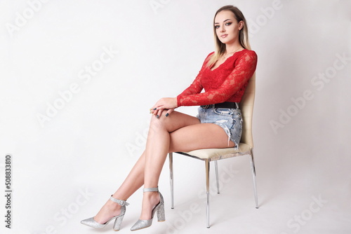 Studio photo session of young Polish model. Beautiful woman with dyed blond hairs and fit body shape.
