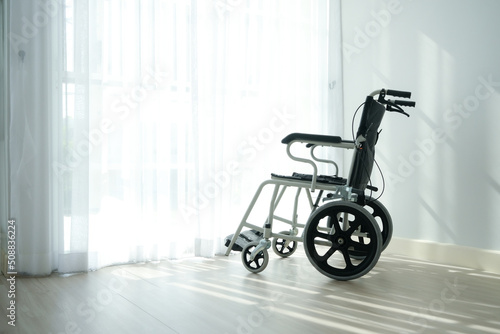 Wheelchair beside glass door,health care and support for patient.