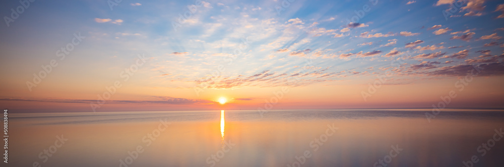 Amazing sunrise over the beach in Chalupy. Seascape with breakwater