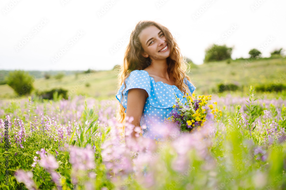 Beautiful woman in the blooming field. Nature, vacation, relax and lifestyle. Summer landscape. Beautiful woman in the blooming field. Nature, vacation, relax and lifestyle. Summer landscape.