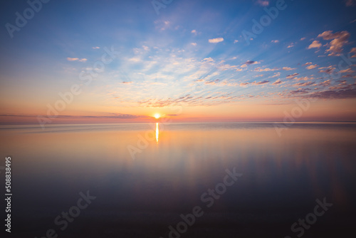 Obraz na płótnie Amazing sunrise over the beach in Chalupy. Seascape with breakwater w salonie
