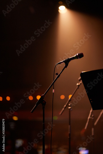 microphone stands on stage. Microphones on stands in the spotlight. microphone stand on stage.