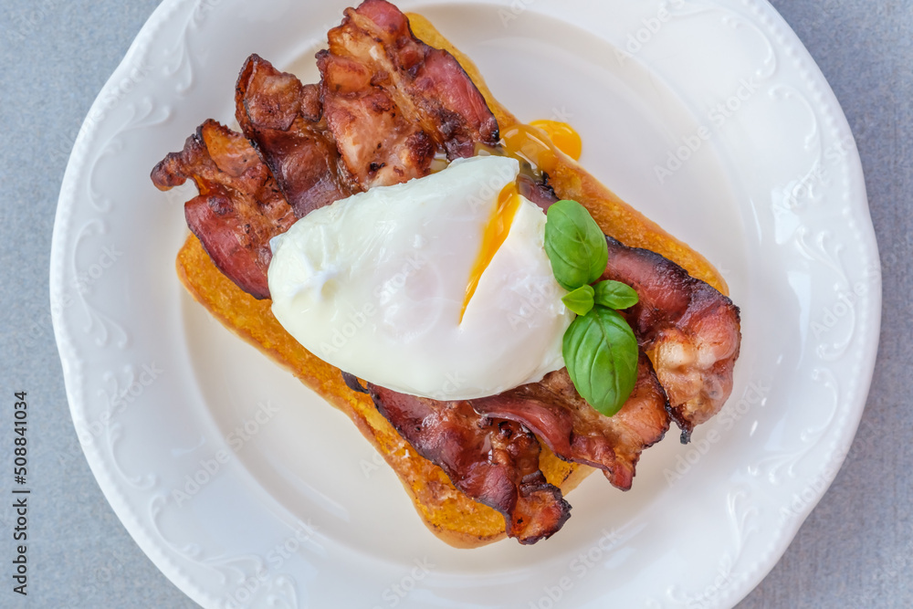 Sandwich with poached egg and bacon Sandwich with poached egg and bacon