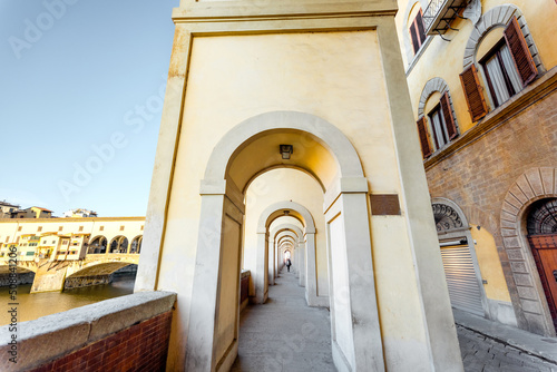 Morning view on beautiful arcade near famous Ponte Vecchio on Arno river in Florence  Italy. Concept of italian renaissance architecture