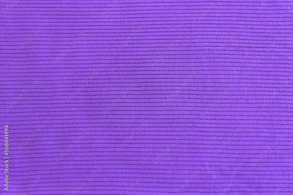 Fototapeta premium Very peri show texture of ribbed cotton fabric. Close up. Cotton clothing and textiles. Natural organic fabrics texture purple, violet colour