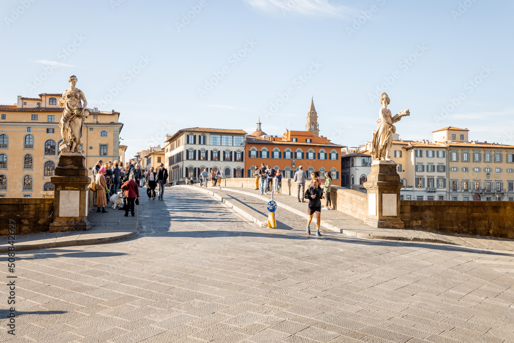 Morning view on Holy Trinity Bridge and riverside of Arno river in Florence city. Travel italian cities of Tuscany. Italian Renaissance architecture