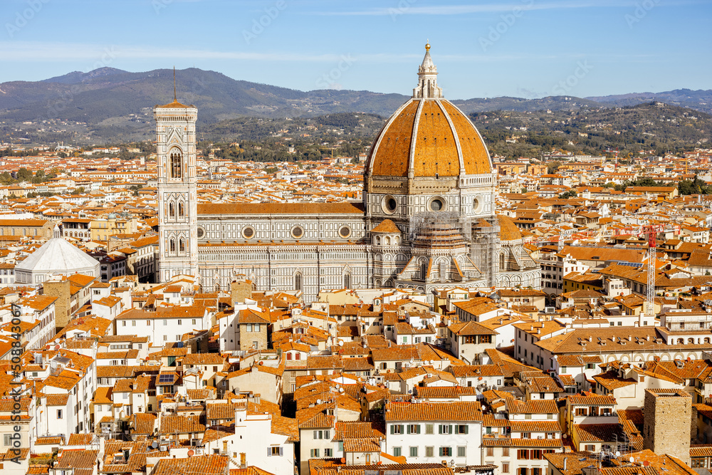 Aerial view on the old town of Florence with famous Santa Maria del Fiore cathedral on skyline on sunny day. Outstanding cityscape of tuscany. View from Vecchio palace