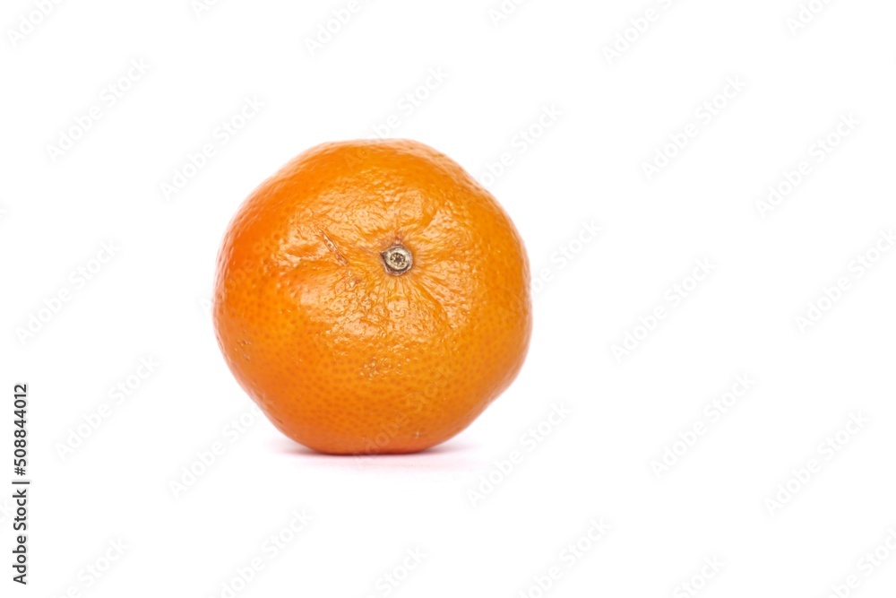 A ripe tangerine isolated on a white background. A ripe tangerine isolated on a white background.