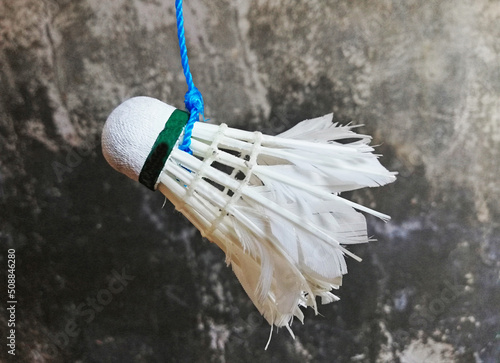 A tide badminton shuttelcock training concept beginner concept on wall background