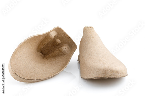 Pair of shoe tree made from recycled cardboard paper isolated on white background, device that used for placed inside a shoe to preserve its shape.