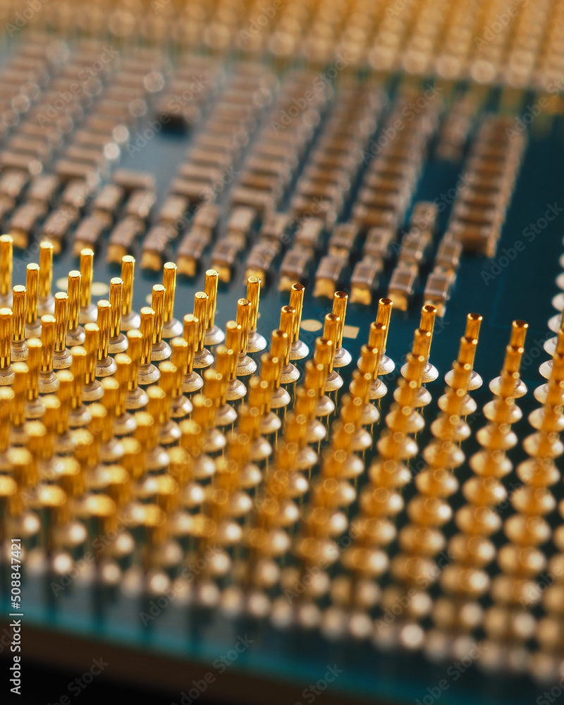 Processor microprocessor of a computer or laptop close up. CPU, semiconductor, pins and connectors. Vertical stories about electronic and computing equipment. Digital technologies. Macro Processor microprocessor of a computer or laptop close up. CPU, semiconductor, pins and connectors. Vertical stories about electronic and computing equipment. Digital technologies. Macro