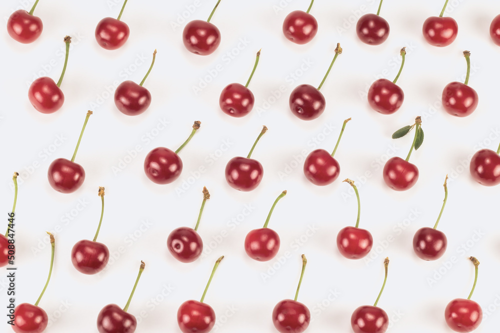 Ripe sour cherries pattern. Organic cherries for a healthy diet. Flat lay. Top view. Ripe sour cherries pattern. Organic cherries for a healthy diet. Flat lay. Top view.