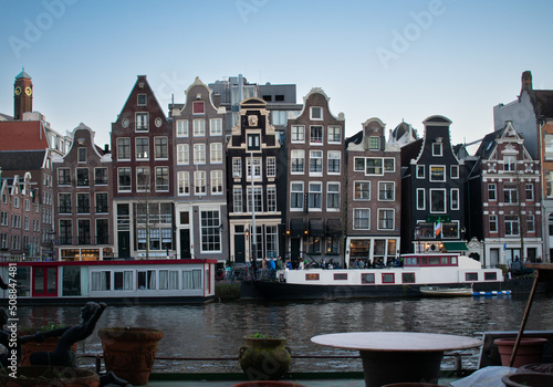 Iconic Dancing houses in Amsterdam Netherlands seen from across Amstel river