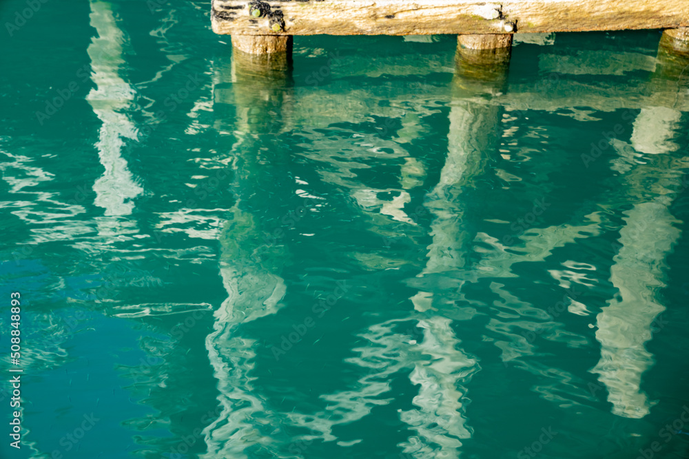 Structure patterns and reflections under historic Jackson Bay pier