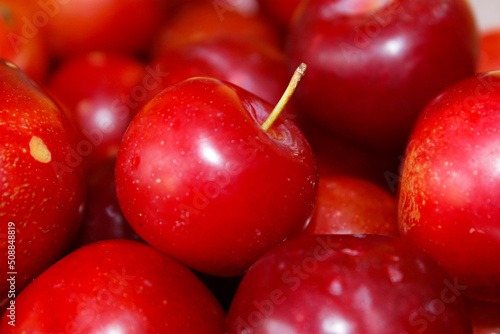 close up of plum fruit kept in the bowl