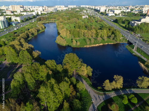 Drone view of a city park with paved bike paths