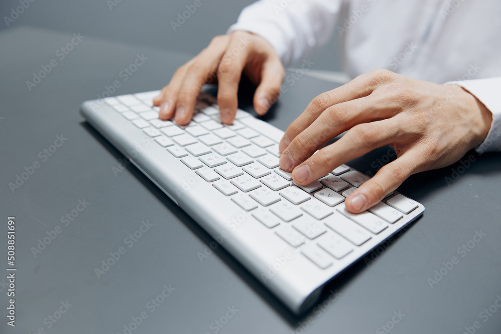 manager sitting at a table with a keyboard in the office isolated background manager sitting at a table with a keyboard in the office isolated background