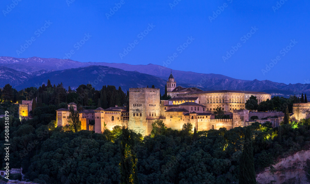 Panorama view of the Alhambra Palace on the hill top in the blue hour time, Granada Spain