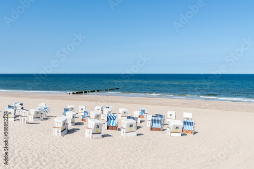 Fototapeta Naklejka Na Ścianę i Meble -  Beach chairs at the Weststrand (West beach) on the North Sea coast, Sylt, Schleswig-Holstein, Germany