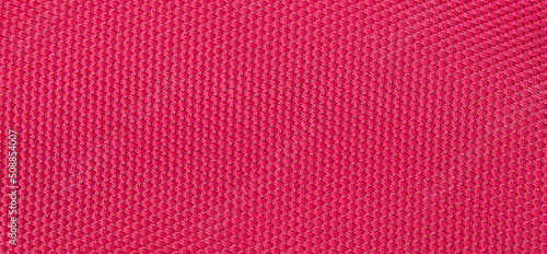 Background texture of coarse woven pink fabric.