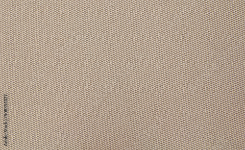 Background texture of coarse woven brown fabric.