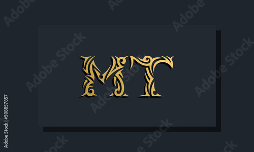 Luxury initial letters MT logo design. It will be use for Restaurant  Royalty  Boutique  Hotel  Heraldic  Jewelry  Fashion and other vector illustration