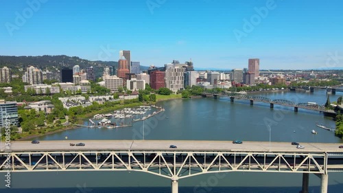 Aerial Drone Video of the Portland, Oregon skyline, a cityscape drone panorama of PDX with bridges and cars crossing the Willamette River photo
