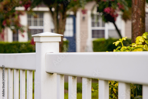 Fototapeta Naklejka Na Ścianę i Meble -  White garden fence outside home