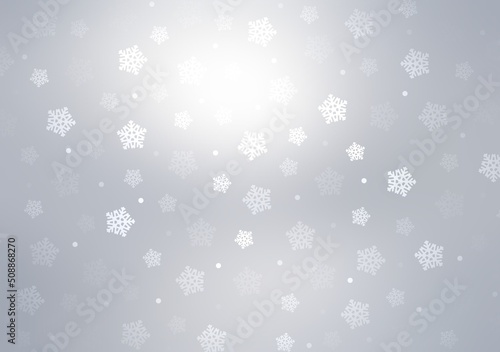 Snowflakes flying on glowing silver empty background. Winter holidays light illustration.