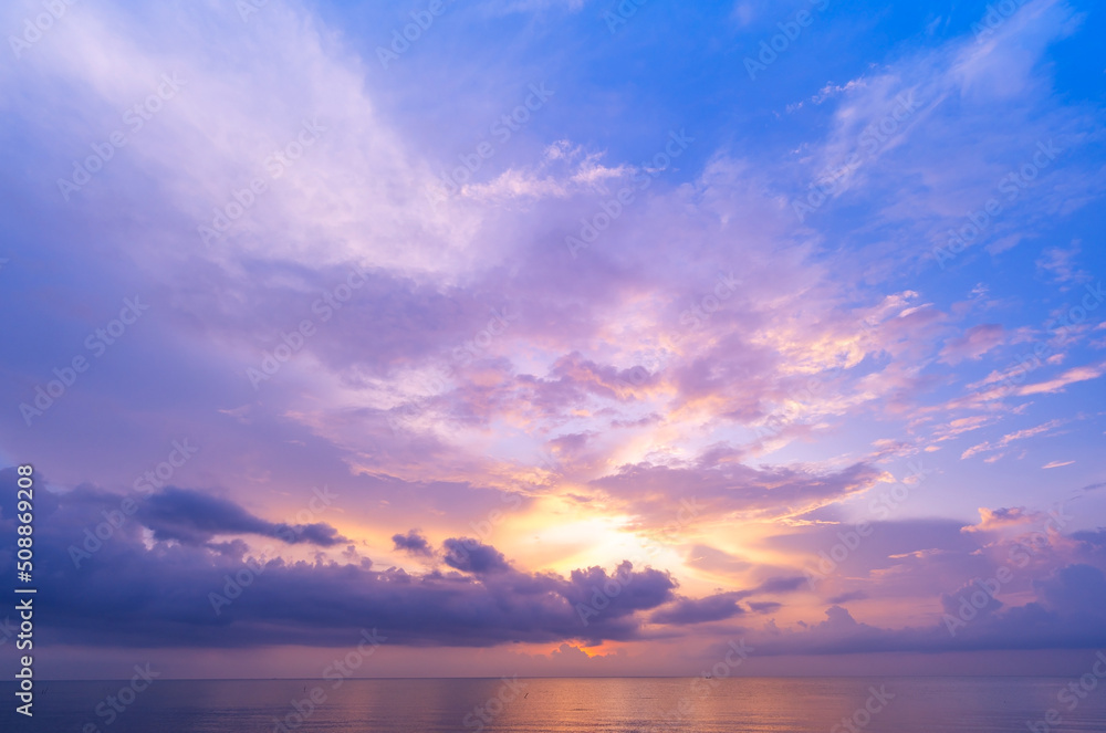 Landscape Long exposure of majestic clouds in the sky sunset or sunrise over sea with reflection in the tropical sea Beautiful seascape scenery Amazing light of nature sunset