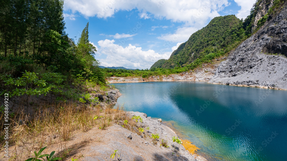 Amazing pond in tropical rainforest forest with mountain rocks peak Beautiful water surface in Phang Nga Thailand Amazing pond in tropical rainforest forest with mountain rocks peak Beautiful water surface in Phang Nga Thailand