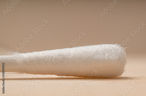 Cotton swab with absorbent wool buds stick isolated on the extreme Macro