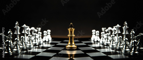 Fotografering King chess stand on chessboard concepts of teamwork volunteer challenge business team or wining and leadership strategy or strategic planning and risk management or team player