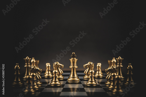 Fotobehang King chess stand on chessboard concepts of teamwork volunteer challenge business team or wining and leadership strategy or strategic planning and risk management or team player