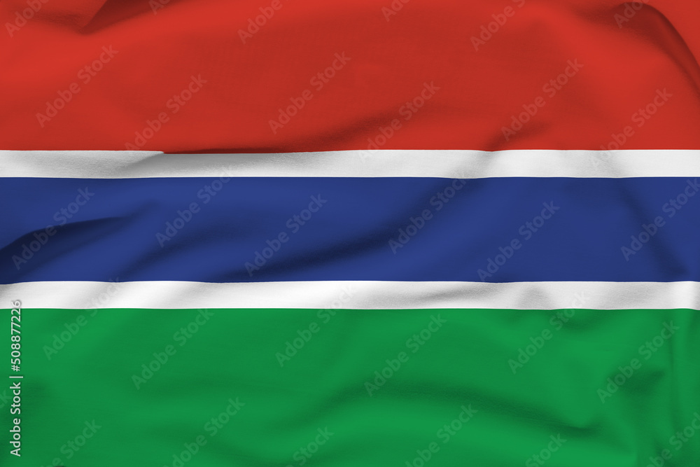 Gambia national flag, folds and hard shadows on the canvas Gambia national flag, folds and hard shadows on the canvas