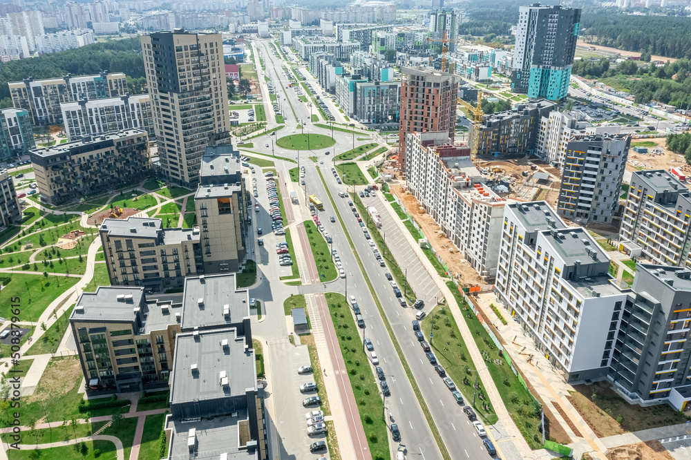 Fototapeta premium aerial view of new urban residential district with apartment buildings and roads. panoramic image.