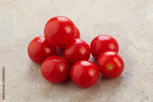 Ripe juicy cherry tomatoes heap