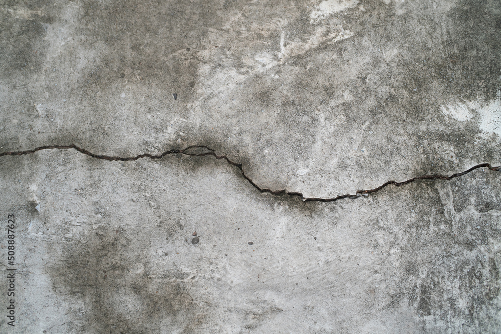 Obraz premium Cracked cement damage wall texture background.