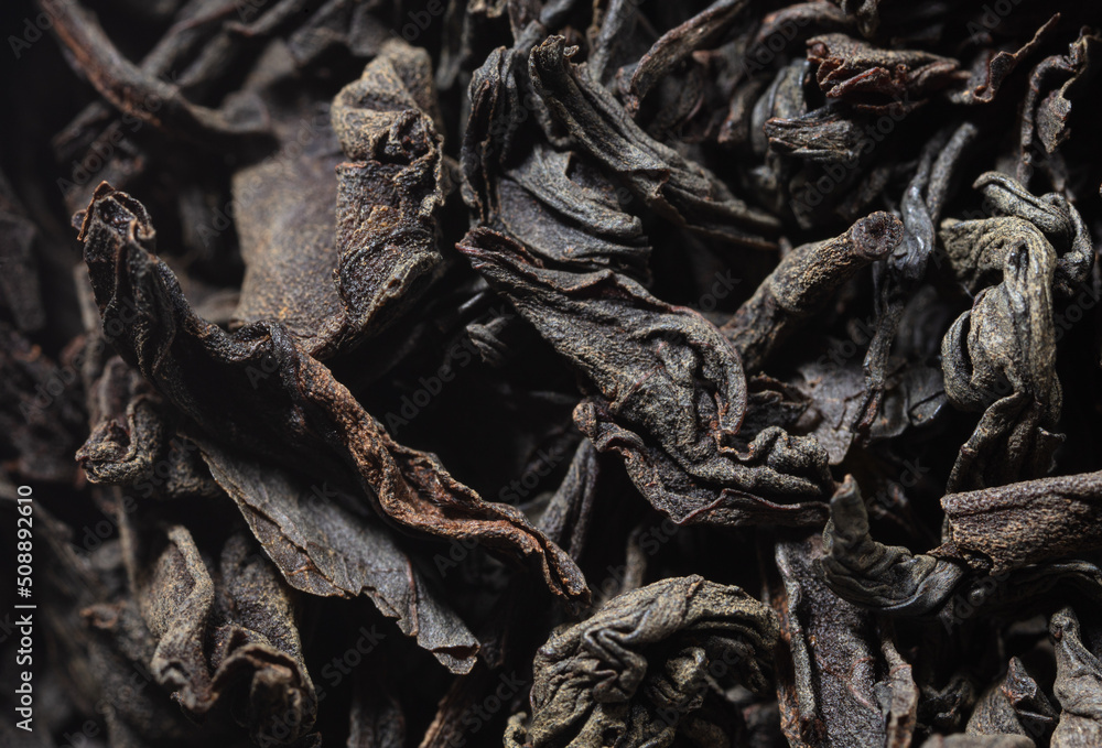 Dried black tea leaves as background. Dried black tea leaves as background.