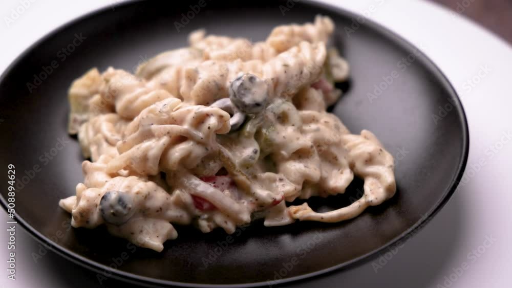 White sauce pasta is creamy and saucy pasta perfectly seasoned with Italian herbs and topped with red chili flakes and olives White sauce pasta is creamy and saucy pasta perfectly seasoned with Italian herbs and topped with red chili flakes and olives