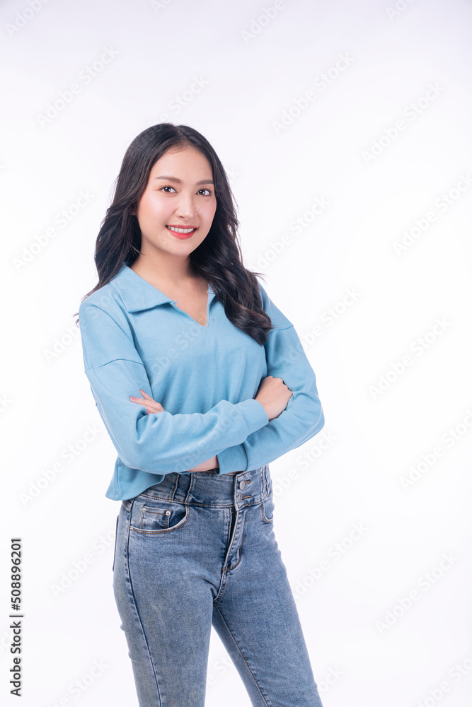 Confident success asian woman standing arms crossed on white background. Positive charming young woman wear casual smiling arms crossed over isolated. Successful occupation lifestyle concept. Confident success asian woman standing arms crossed on white background. Positive charming young woman wear casual smiling arms crossed over isolated. Successful occupation lifestyle concept.