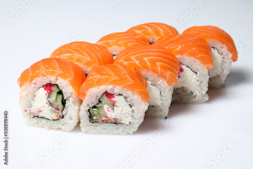 Tasty sushi and sushi roll set with wasabi and ginger on white background. Vegan sushi rolls. Seafood.