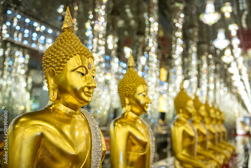 Golden Buddha and  glitter glass column at Wat Tha Sung, Uthai